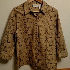 Tan and black embroidered button down shirt.